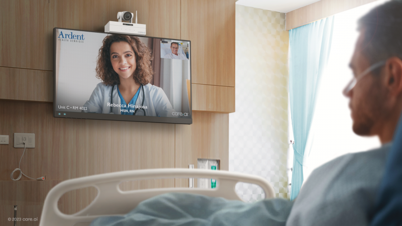 Patient room with virtual nurse on wall-mounted screen 